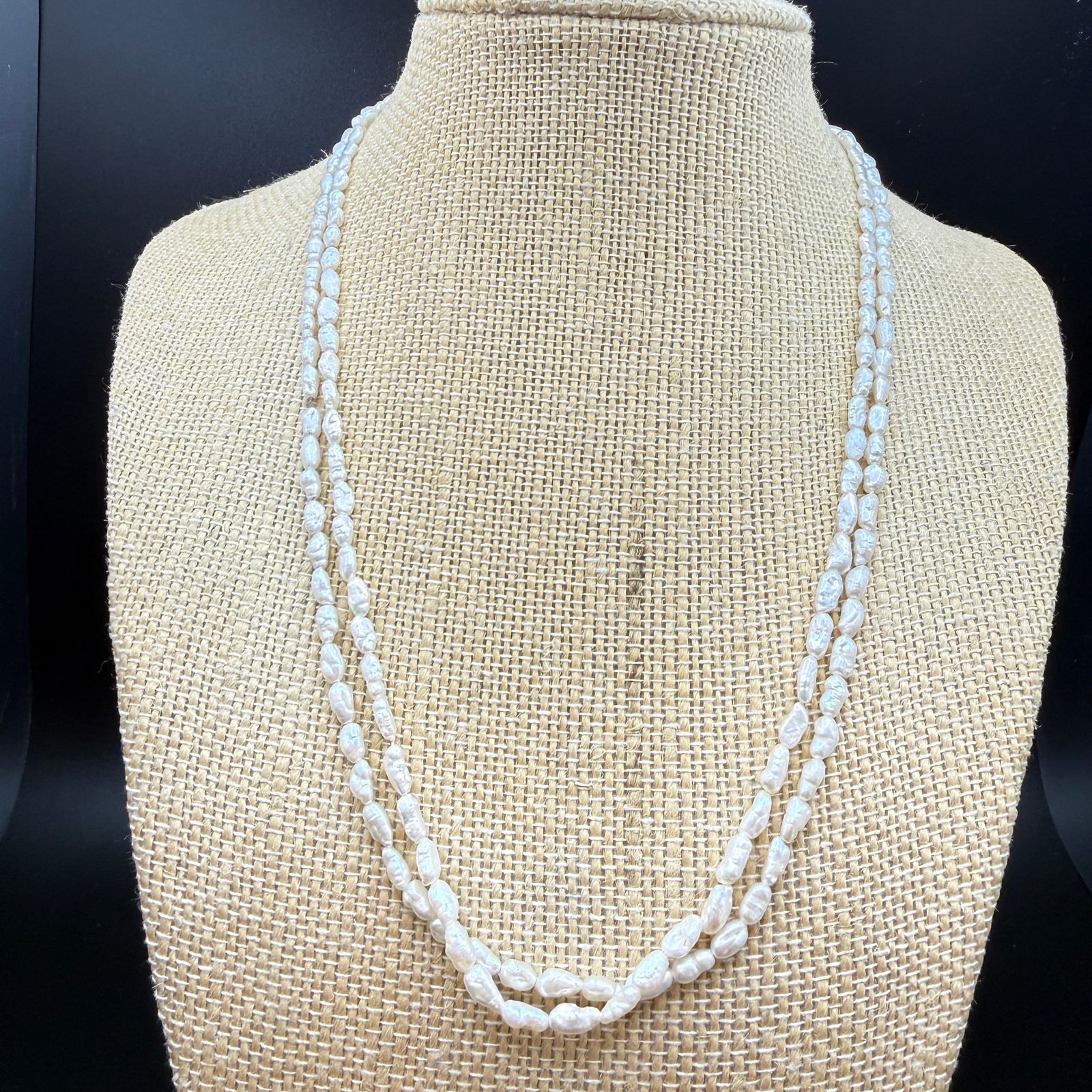Double Strand Baroque Pearl Necklace 14K: Elegant double-strand necklace composed of irregular baroque freshwater pearls displaying soft white tones with subtle iridescent overtones Finished with a 14K yellow gold spring ring clasp, clearly m