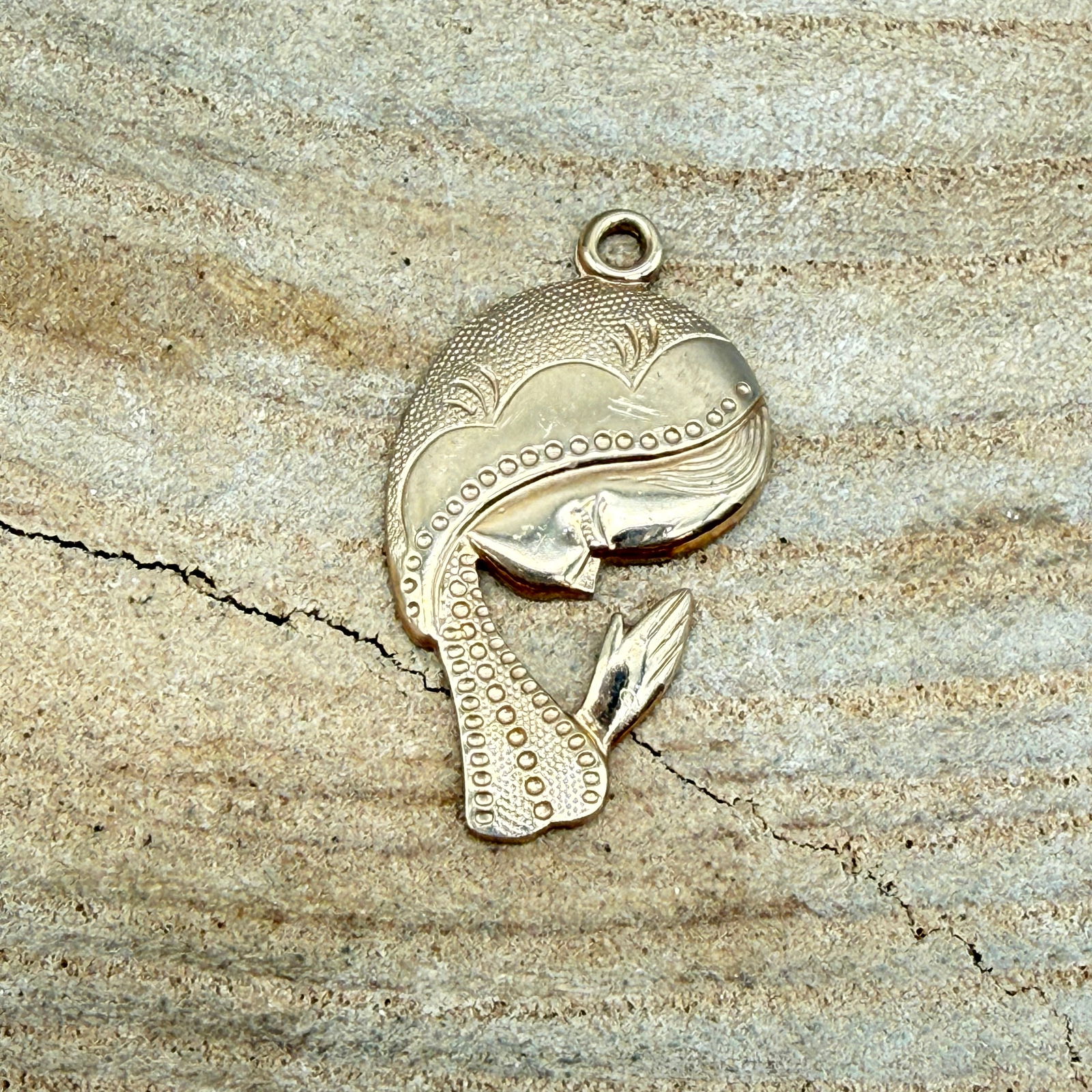 14K Gold Filled Figural Praying Lady Pendant, 2.0g: Figural praying lady pendant marked 1/20 14K GF, indicating 1/20th 14K gold filled construction. Stylized flowing hair with hands clasped in prayer and textured detailing throughout. Measures approxim