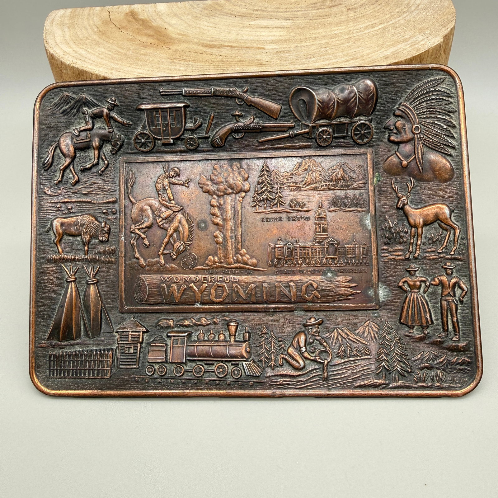 Vintage “Wonderful Wyoming” Copper Tray: Vintage high-relief “Wonderful Wyoming” trinket tray, copper-tone metal, marked Made in Japan on reverse.Rectangular plaque featuring detailed Western and Wyoming-themed imagery including cowb