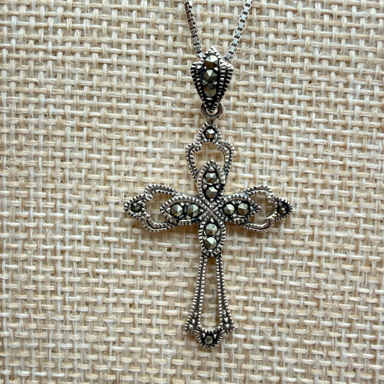 Marsala Sterling Marcasite Art Deco Cross Necklace: Sterling silver marcasite cross pendant by Marsala Manufacturing, presented in an elegant Art Deco–style openwork design with detailing and inset marcasite stones throughout. Pendant is marked 925 a