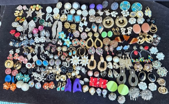 Vintage Clip-On Earrings Large Lot 115 Pairs: Large estate lot of approximately 115 pairs of vintage clip-on earrings in a wide assortment of styles, colors, and materials.This collection includes a vibrant mix of mid-century to late 20th century