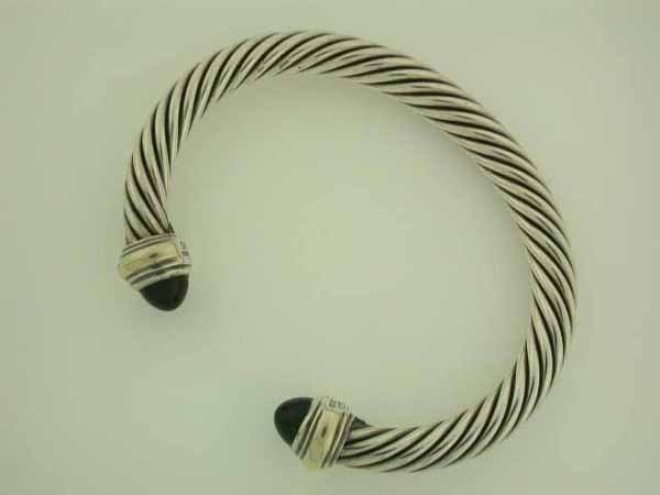 David Yurman Color Classic Onyx Cable Bracelet: David Yurman Sterling Silver and 14k Yellow Gold Cable Bracelet with Onyx around 7mm and wrist size is 6.5 to 6.75 and weighs 42.7 grams