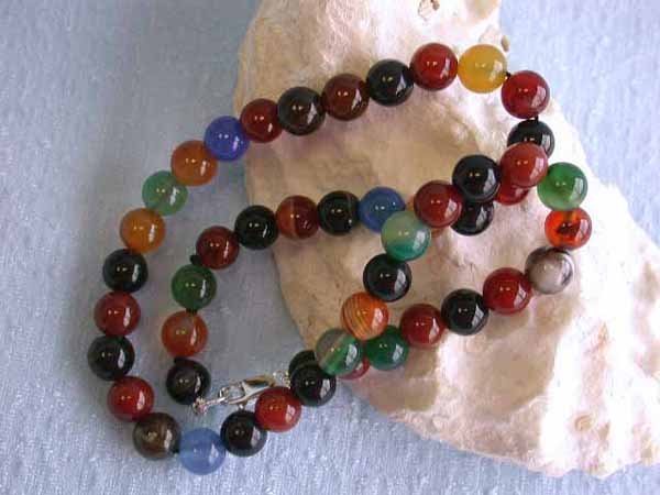 Multi-colored Agate Stones with Silver Clasp: Agate Necklace 8 mm beads w/ Silver Clasp and approximately 15.5 inches long.