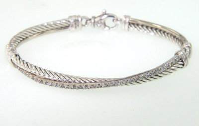 David Yurman Silver, Diamond Bangle: David Yurman Silver, Diamond Bangle. Bangle's Weight: 16.4 grams. Total diamonds weight: 0.49 cts, I color, SI-1 clarity. The measurements of the inside Bangle: 52 x 45 mm. There is Stampe "D.Y 925".