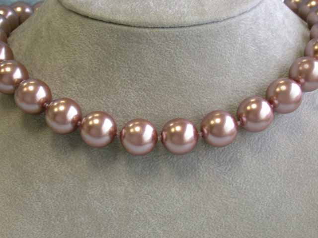 Colored Shell Pearl Necklace with Yellow Gold Clasp: Shell Pearl Necklace approximately 14.3 mm bead size with 14k Yellow Gold Clasp and the length is approximately 18 inches long