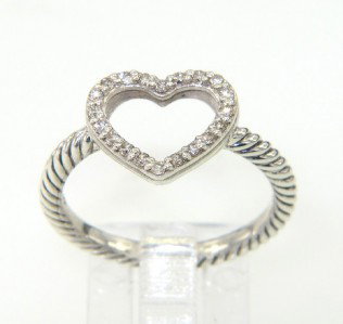 David Yurman Silver, Diamond Ring: David Yurman Silver, Diamond Ring.The total ring's weight is 2.5 grams.The total weight of diamond is 0.13 cts. approximately , I color SI clarity.The size of the ring's surface is 8 x 10 mm.The size 