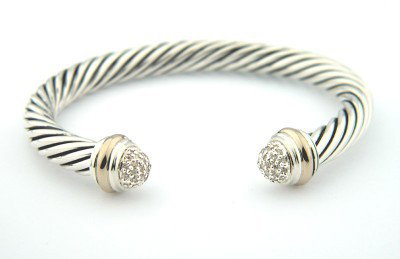 David Yurman Silver / 18K Gold Diamond Bangle: David Yurman silver / 18K Gold Diamond Bangle.Bangle's Weight: 43.7 grams.The weight of diamond: 0.66 cts, I color,VS clarity.The measurements of the Inside Bangle is 54 x 44 mm and the thickness is 6