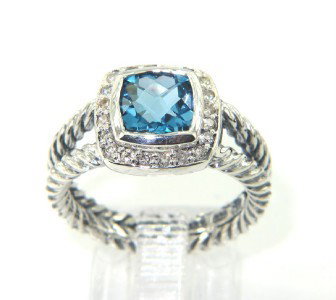 David Yurman Silver Blue Topaz Diamond Ring: David Yurman Silver Blue Topaz Diamond Ring.The total ring's weight is 5.6 grams.The total weight of the diamond is 0.20 cts approximately, I color SI clarity.The size of the Blue Topaz is 6 x 5 mm.Th