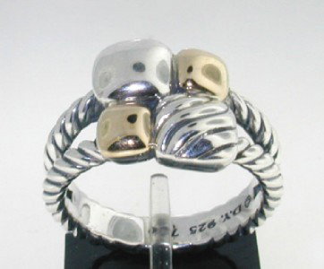 David Yurman Silver & 18K Yellow Gold Ring : David Yurman Silver & 18K Yellow Gold Ring. The total ring's weight is 6.7 grams. The measurement of ring's surface: 10 x 10 mm and 3 mm in thickness. The size of the ring is 6.75