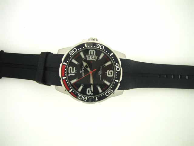 Mens Croton Rubber 24 Hour Date Watch: CROTON presents precision, quality, value and style in a sporty mens watch with silver luminous hands and markers and date window set in a sharp black face with red/black rotating bezel
