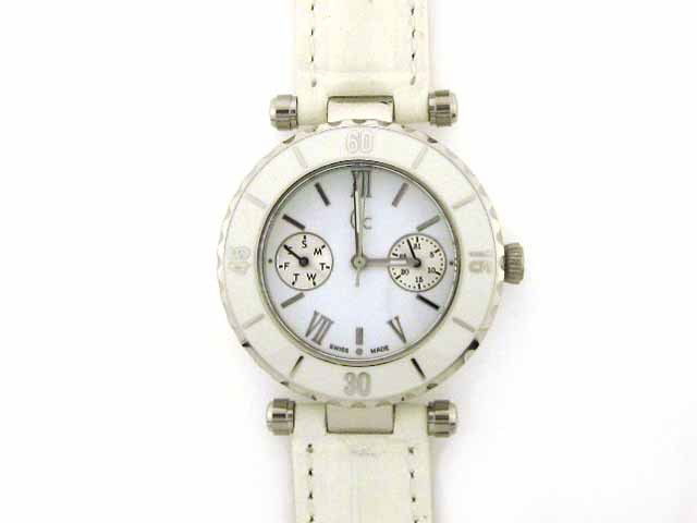 GUESS SWISS QUARTZ MULTI FUNCTION WATCH: • Round casing • Polished silvertone color of stainless steel in case and case back • White tone ceramic accent on the bezel with two subdials for day and date • Mineral is crystal for scratch