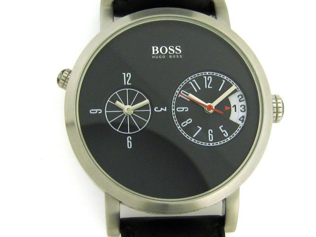 Hugo Boss stainless steel dual-time watch Watch: This is a Hugo Boss stainless steel dual-time watch with the following features: round black dial; two time-zone displays; date function; splash of red on the chic black dial; leather band; stainless 