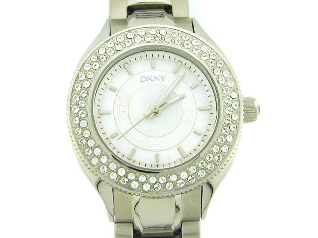 DKNY Womens Diamond NY4467 Watch: This is a DKNY Womens Diamond NY4467 Watch with the following features: Stainless Steel Case with Crystals on the Silver tone bezel and on the Push/Pull crown, Silver MOP Dial, Analog Display, Stainle