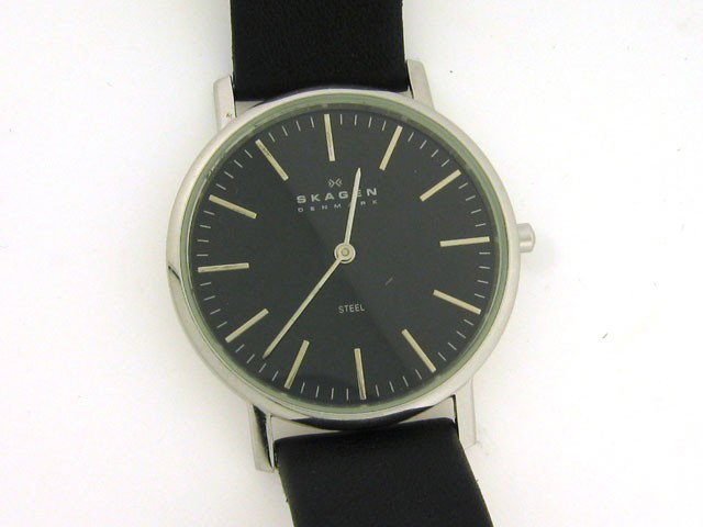 Skagen Slimline Black Dial Mens Watch 18LSLB: This is Skagen Slimline Black Dial Mens Watch 18LSLB with the following features: Stainless steel case; black leather strap; Fixed stainless steel bezel; Black dial with silver-tone hands and index ho