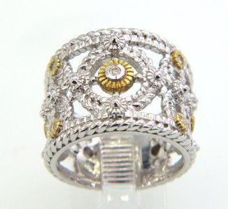 Judith Ripka Silver/18K Gold and Diamond Ring: Judith Ripka Silver/18K Gold and Diamond RingThe total ring weight is 8.9 gramsThe total weight of diamond: 0.14 cts. I color SI claritThe ring is 15 mm wide and 1 mm in thicknessThe size of ring: 6.2