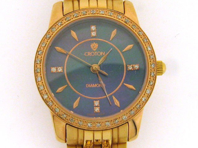 Croton Ladies Diamond Case Black Mother of Pearl Watch : This is a Croton Ladies Diamond Case Black Mother of Pearl Watch CR207935 with the following features: Sapphire crystal; Black mother of pearl dial; All stainless steel; Swiss quartz; diamond markers 
