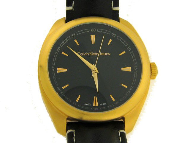 Calvin Klein Watch (K58114.02): This is a Calvin Klein Watch (K58114.02) with the following features: all stainless steel; swiss made; leather band with CK logo; Push/pull crown with CK logo; gold tone markers and indicators; and wa