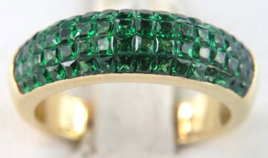 Tiffany & Co. 18K Yellow Gold Emerald Ring: Tiffany & Co. 18K Yellow Gold Emerald Ring.The weight of the ring is 8.5 grams.The weight of the emerald is 0.60 ct approximately.The size of the ring is 8.