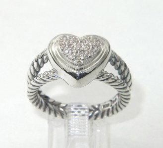 David Yurman Silver Diamond Ring: David Yurman Silver Diamond Ring.The total ring's weight is 7.3 grams.The total weight of diamond is 0.28 cts. approximately , I color SI clarity.The size of the ring's surface is 11 x 12 mm and 5 mm 