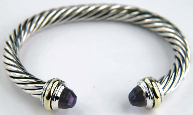 David Yurman 14K Silver/Gold Amethyst Bangle: David Yurman 14K Silver/Gold Amethyst Bangle. The total Bangle's weight is 39.6 grams. The size of Amethyst : 9 mm. The measurement of the inside bangle is 52 x 36 mm. Thickness : 7 mm.