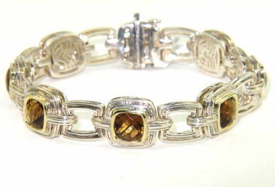Charles Krypell Gold Citrine Bracelet: ​Charles Krypell 14K Gold / Stainless Steel Citrine Bracelet Weight of Bracelet: 34.4 grams. The measurement of citrine: 5 x 5 mm. The length of Bracelet: 7". The bracelet is 11 mm wide and 6 mm