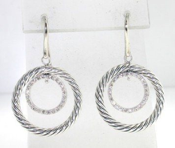 David Yurman Silver Diamond Earrings: David Yurman Silver Diamond Earrings. The total earrings weight is 6.8 grams. The total weight of diamond : 0.50 cts. The size of earrings: 1.5" long.