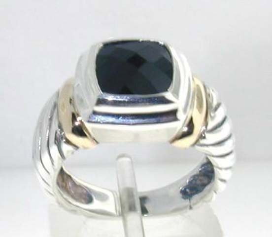 David Yurman Silver & 14K Yellow Gold Onyx Ring.: David Yurman Silver & 14K Yellow Gold Onyx Ring. The total ring's weight is 6.8 grams. The size of the Onyx is 8 x 8 mm. The size of the ring is 5.75"