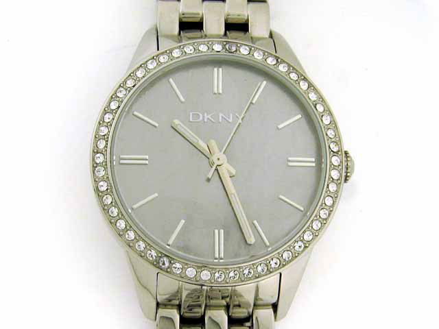 DKNY Women's Watch: Mother-of-pearl dial, round stainless steel case with crystals, stainless steel band, analog display, quartz movement, stainless steel, water resistant to 50 meters (165 feet), and watch length is app