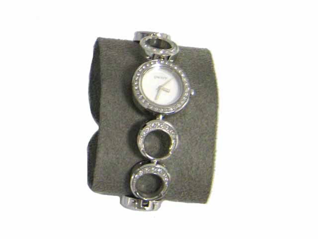 DKNY Women's Open Circle Bracelet Watch: 24mm silver dial, silver band, analog display, quartz movement, stainless steel case, stainless steel band, water resistant to 50m, silver dial, and watch length is approximately 7 inches long (with t