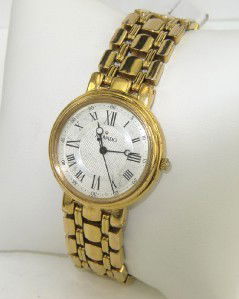 Movado Stainless Steel Roman Numerals Watch: Movado Stainless Steel Roman Numerals Watch The total watch's weight is 45.3 grams. The measurements of the watch head is 25 x 25 mm and 5 mm thick. The length of watch: 6.5". Swiss Made. Water Resist