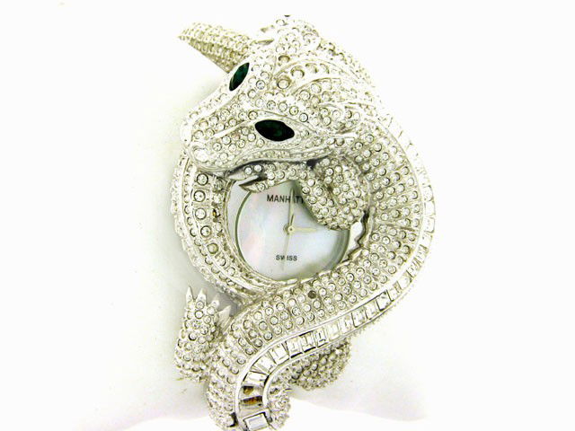 Croton Ladies Manhattan Watch: This is a Croton Ladies Bangle Watch with Model # CR 204178. The watch is Stainless steel with Swiss quartz movement. It has crystals, emerald and mother of pearl dial.