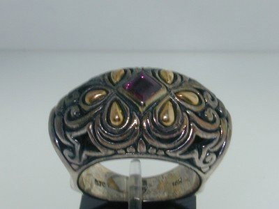 BJC 18K Yellow Gold/Silver Tourmaline Ring.: BJC 18k Yellow Gold/Silver Tourmaline Ring. The total ring's weight is 14.1 grams. The size of the Tourmaline is 4x4 mm. The size of the ring is 8.75".