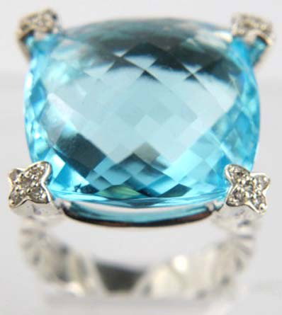 David Yurman Silver Blue Topaz & Diamond Ring: David Yurman Silver Blue Topaz & Diamond Ring. The total ring's weight is 13.5 grams. The total weight of the diamond is 0.25 cts approximately, H - I color VS - SI clarity. The size of the blue topaz