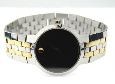 Movado 2-Tone Stainless Steel Quartz Watch: Movado 2-Tone Stainless Steel Quartz Watch. The total watch's weight is 89.6 grams. The measurements of the watch head is 29 x 34 mm and 3 mm thick. The length of watch: 8". Swiss Made. Water Resistan