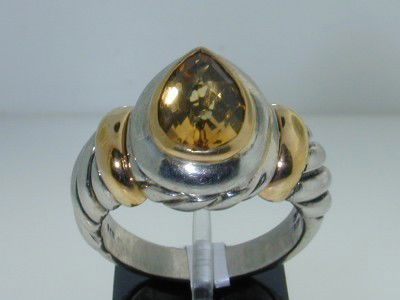 BJC Silver/14K Yellow Gold Citrine Ring.: BJC Silver/14K Yellow Gold Citrine Ring. The total ring's weight is 11.6 grams. The size of the pear shape citrine is 12 x 8 mm. The measurement of the ring's surface is 20x18 mm and Thickness: 8 mm.