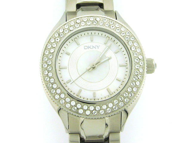 DKNY Womens Diamond NY4467 Watch: This is a DKNY Womens Diamond NY4467 Watch with the following features: Stainless Steel Case with Crystals on the Silver tone bezel and on the Push/Pull crown, Silver MOP Dial, Analog Display, Stainle