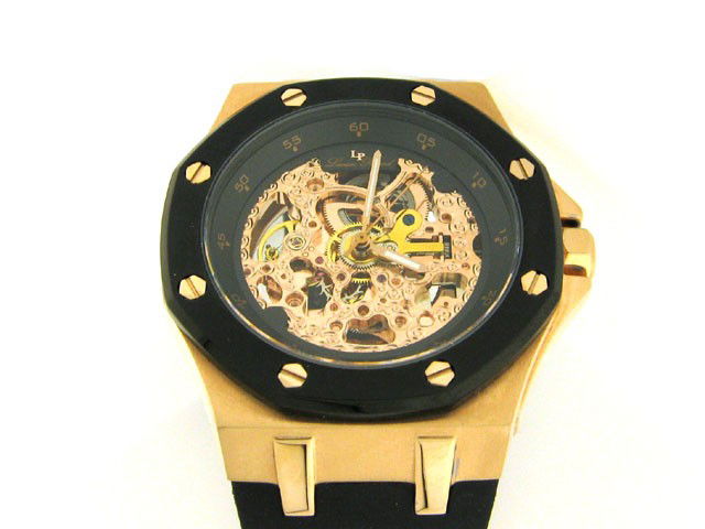 Lucien Piccard Men's 'The Trans' Watch in Stainles: This is a Lucien Piccard Men's 'The Trans' Watch in Stainless Steel with 18K Rose Gold and Rubber Strap (28586ROBK) with the following features: Stainless Steel; 18k rose gold ion plating; Black color