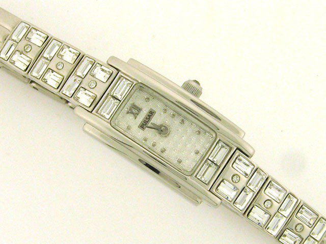 Pulsar Ladies Crystal Watch: This is a Pulsar Ladies Crystal Watch with the following features: made with crystallized Swarovski elements (26 crystals); Crystal cabochon crown; Water resistant; Stainless Steel; and Quartz movemen