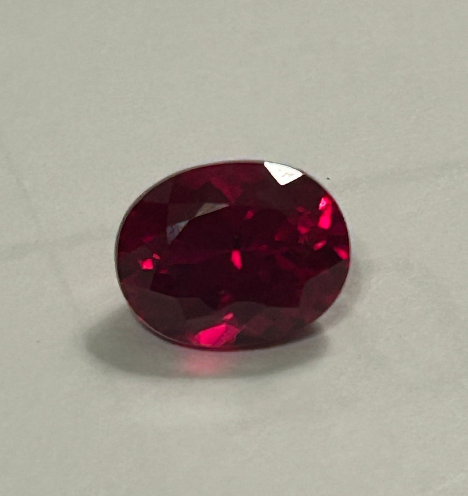 Mozambique Dark Red Ruby Oval Cut 9.70 ct: Mozambique Dark Red Ruby Oval Cut 9.70 ct Prized for its deep red color, often with hints of brown or purple, shaped into an elegant oval, offering significant size and rich color that's ideal for sta