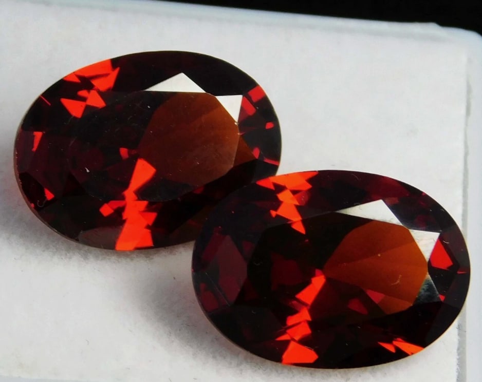 Natural Cambodian Red Zircon Oval Cut 12.45 Ct PAIR from Cambodia: a rich, deep red "jacinth" color, good clarity and significant brilliance,showcasing fire, though they're soft so require careful handling.