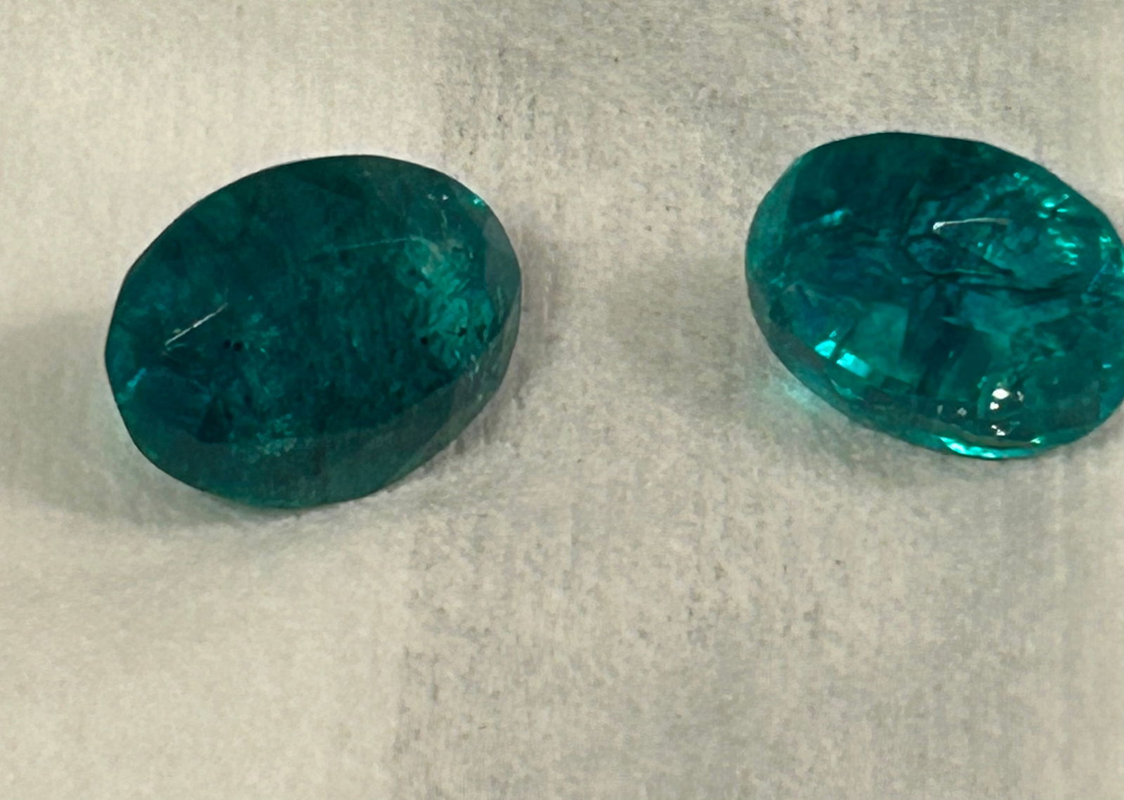 Natural Colombian Green Emerald 10 ct each Oval Cut PAIR: These large, earth-mined stones feature excellent cut, eye clean to translucent clarity.