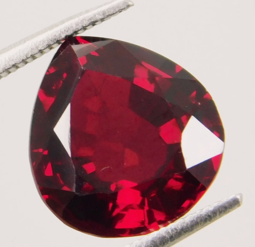 Deep Maroon Ruby Pear Cut 8.7 ct from Mozambique: Known for its rich, dark color, often with purplish or brownish undertones, offering significant brilliance and value, eye-clean with excellent clarity and cut, making it a prized collector's item for