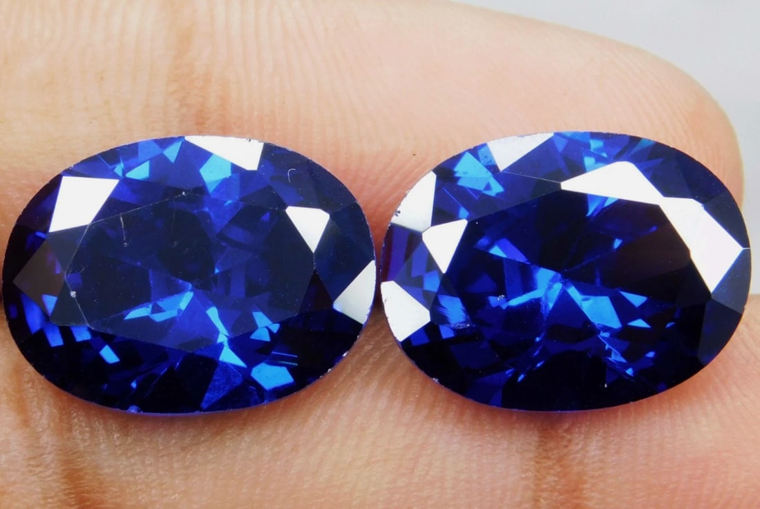 Flawless Blue Sapphire PAIR Oval Cut 9.93 ct Brazil: Sourced from Brazil, this represents a rare and high-value, top-clarity gemstone. Such a large, pristine, and naturally sourced stone is typically valued for its deep, intense blue color, exceptional