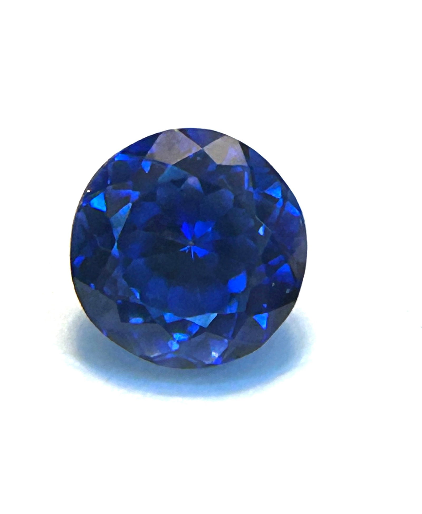 Translucent Blue Sapphire Round Cut 4.95 ct from Sri Lanka: A valuable gem known for its vibrant, cornflower blue hues, excellent clarity, and exceptional brilliance, having a unique "luster" or "glow," reflecting high craftsmanship and traditional Sri Lankan
