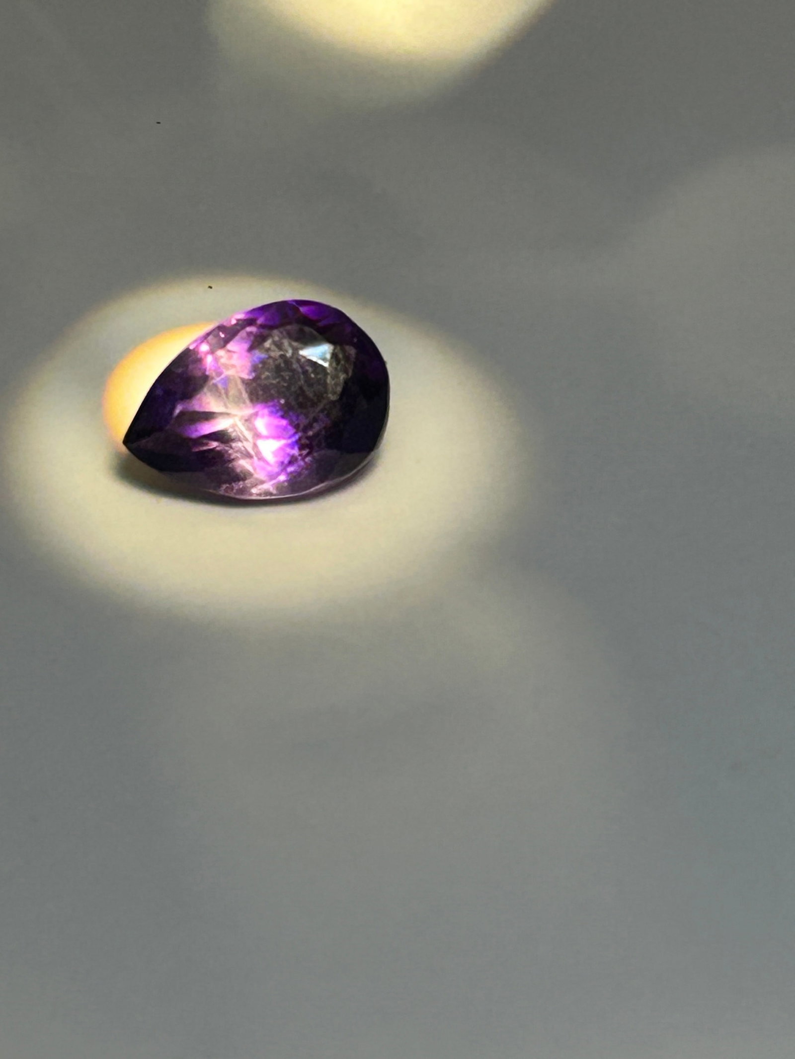 Deep Purple Amethyst 8 ct Pear Cut really Nice color! Unique Banding: a substantial, vibrant, and, teardrop-shaped gemstone, typically sourced from Brazil or Africa. It features a rich violet-purple color, often with eye-clean or VVS-VS clarity, and is commonly used for