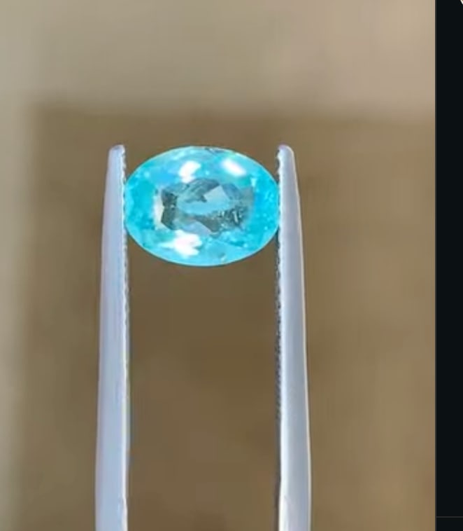 Neon Blue Paraiba Tourmaline Oval Cut 3 ct from Brazil: an exceptionally rare, copper-bearing gemstone known for its intense, electric blue to neon blue-green color, often exhibiting high saturation.