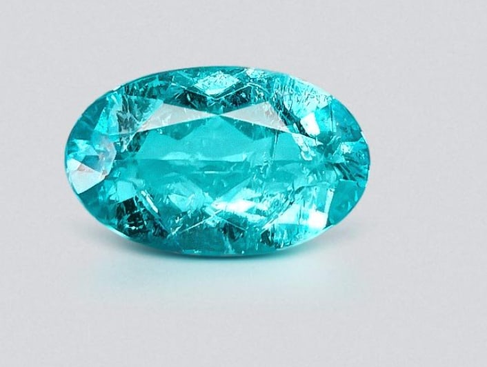 Neon Blue Paraiba Tourmaline Oval Cut 3 ct from Brazil: an exceptionally rare, copper-bearing gemstone known for its intense, electric blue to neon blue-green color, often exhibiting high saturation.