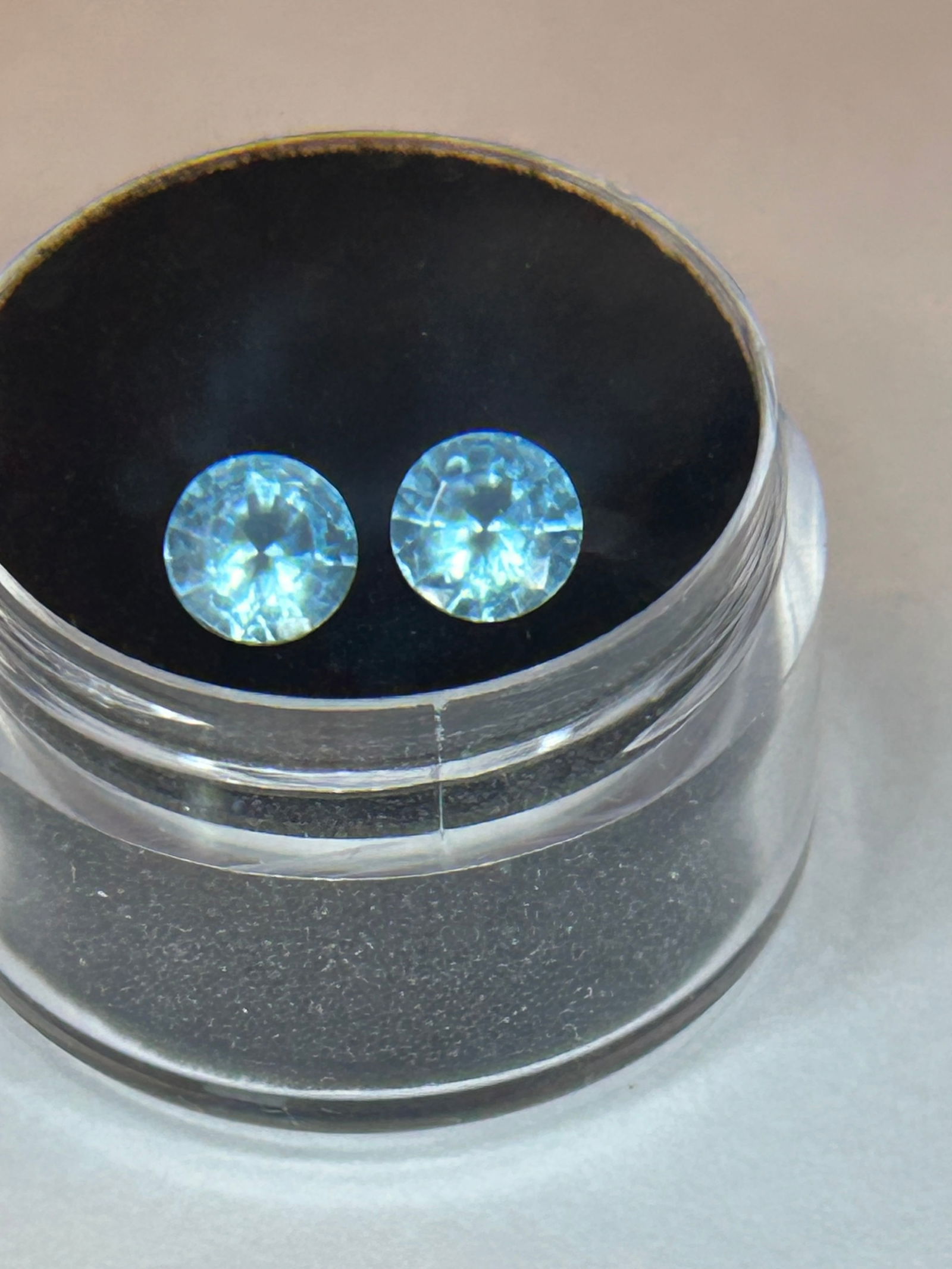 2ct round cut Pair of Sky Blue Tanzanite untreated.: A 2-carat pair of untreated "sky blue" tanzanite refers to a matched set of natural, unheated gemstones, displaying a natural light-blue or silvery-blue hue. Due to the high rarity of natural, unheate