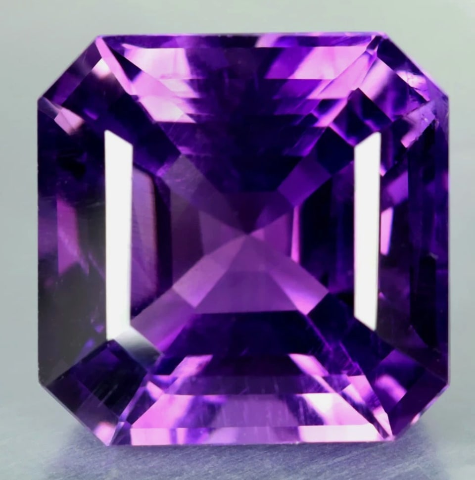 1.66 ct Octogon Cut Natural Purple Amethyst: natural purple amethyst,sourced from Brazil, is an eye-clean to VVS-clarity gemstone featuring an elegant, precision-cut octagon shape . This violet-purple variety of quartz exhibits high-quality, sat