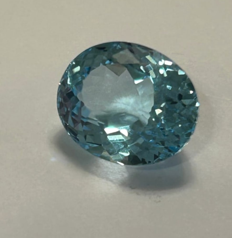 Sky Blue Topaz 14.58ct Oval Cut From Brazil: Sky Blue Topaz is a substantial, pale-blue, transparent gemstone, Light, serene color. Mined in Brazil, this large, faceted gem offers excellent clarity and a high-value.